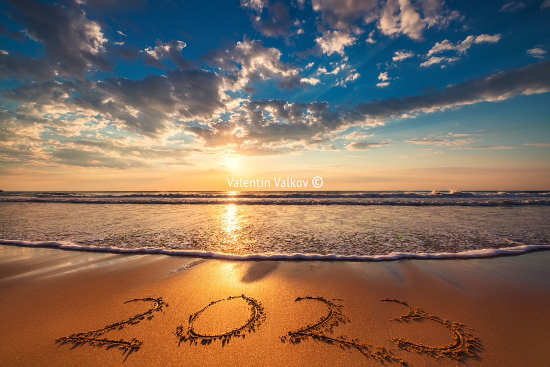 "Happy New Year 2023 concept, lettering on the beach. Written tex" stock image