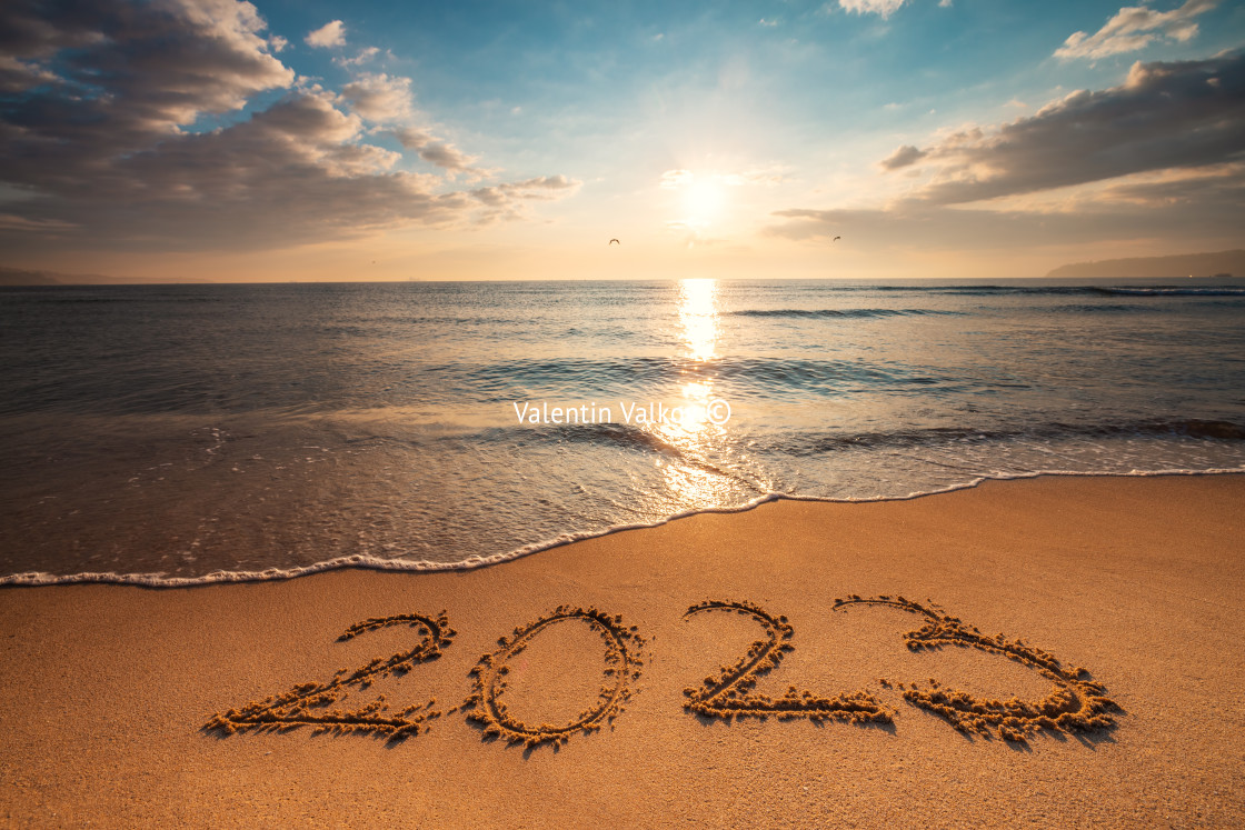 "Happy New Year 2023 concept, lettering on the beach. Written tex" stock image