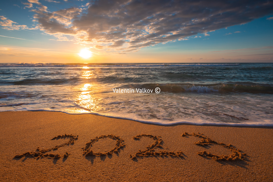 "Happy New Year 2023 concept, lettering on the beach. Written tex" stock image