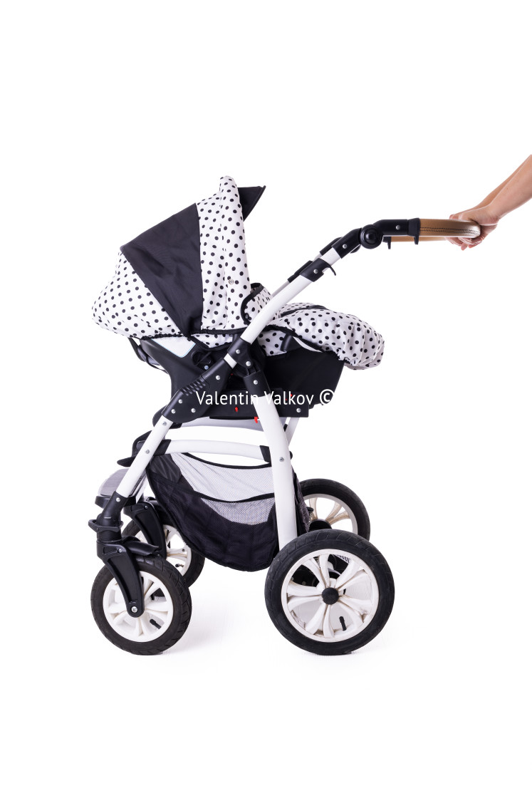 "Modern baby stroller with bassinet and car seat isolated on a wh" stock image