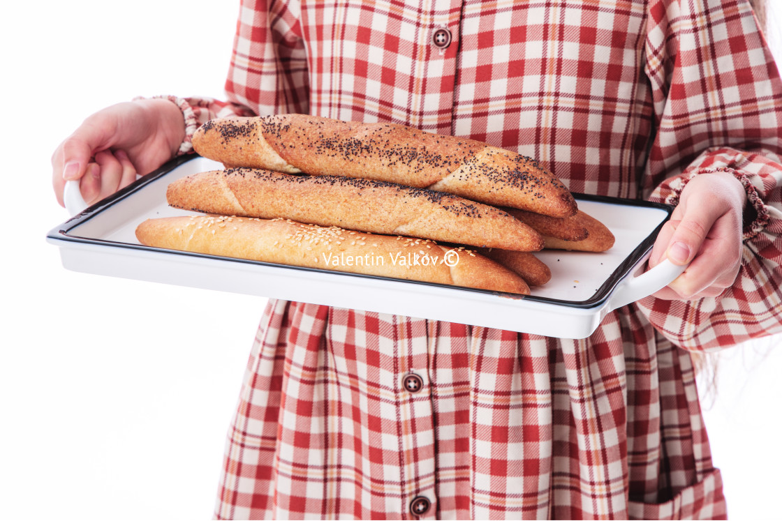 "Girl baker in vintage dress serving freshly baked homemade bread" stock image