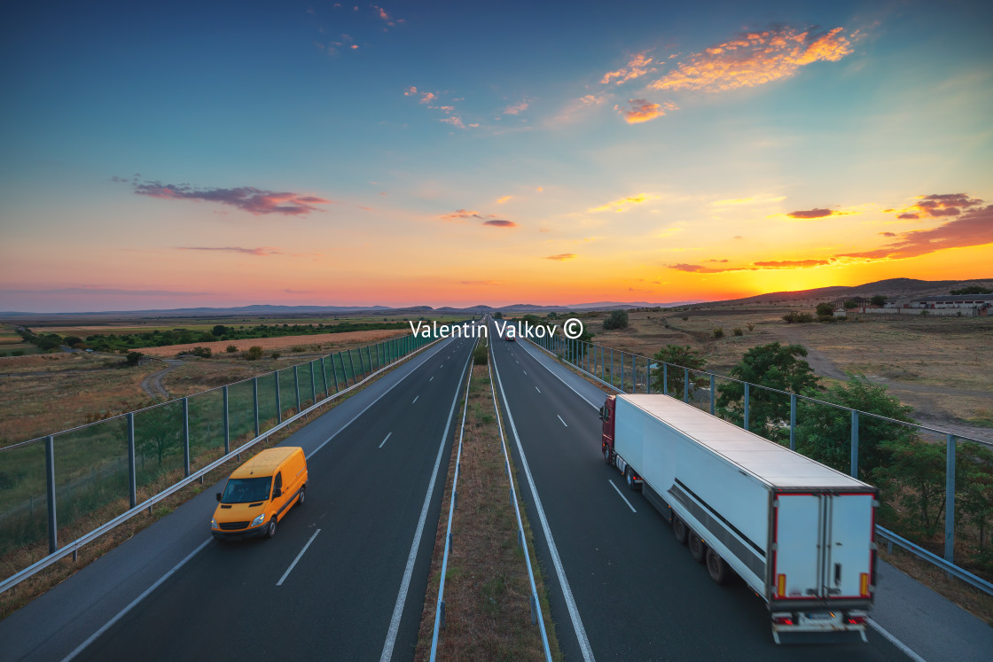 "Driving on open road at beautiful sunset. Aerial view" stock image