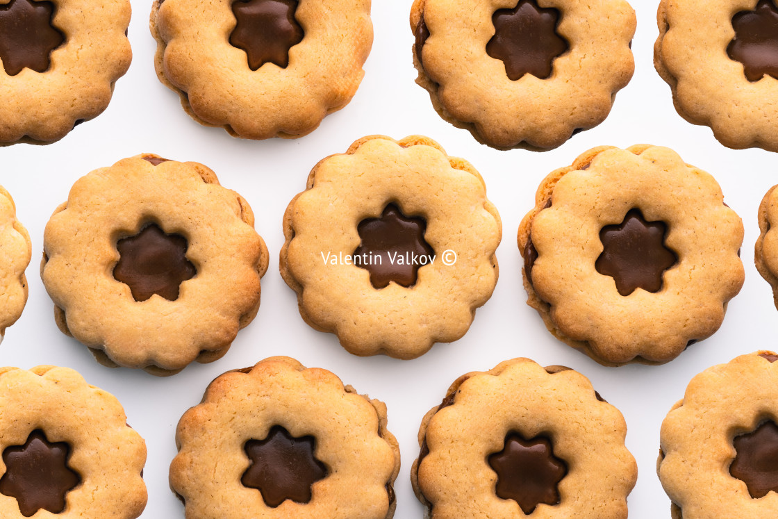 "Traditional Christmas Linzer cookies Austrian or German biscuits with shortcrust pastry and jam filling isolated on white background" stock image