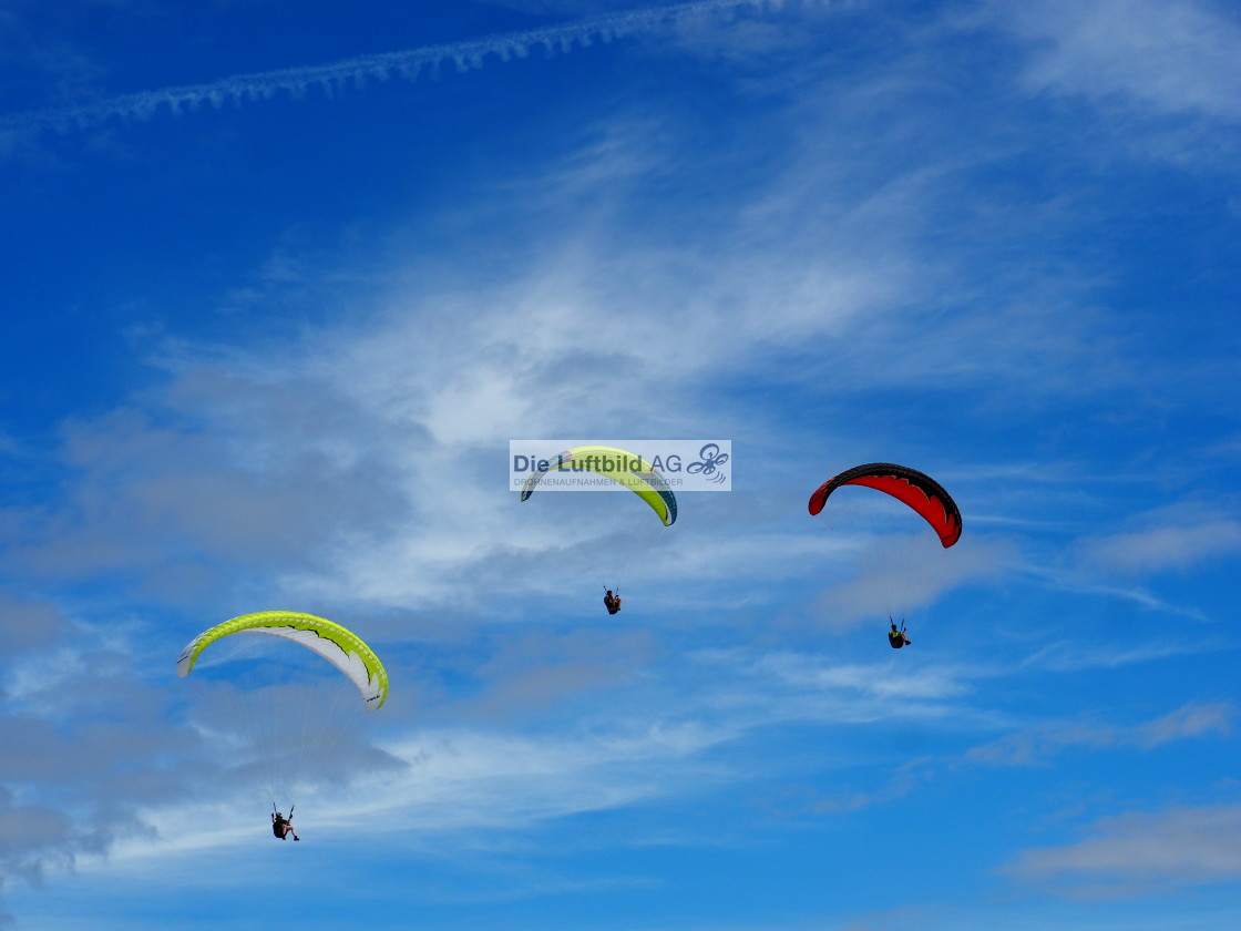 "The 3 Paraglider in Clouds with deep blue Sky" by Die Luftbild AG Hans-Jörg Behrendt - $1.23 "The 3 Paraglider in Clouds with deep blue Sky" stock image