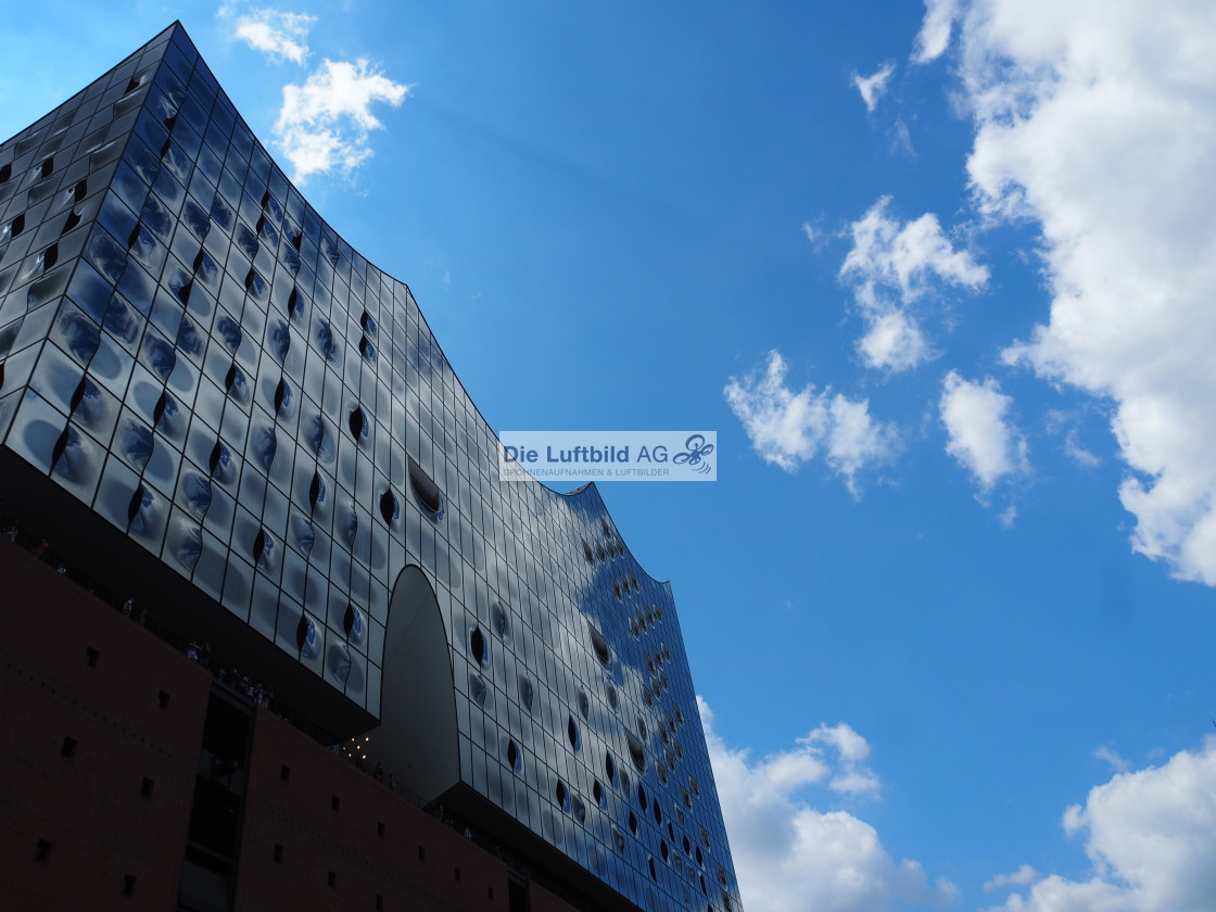 "Die Elbphilharmonie Hamburg spiegelt Wolken und blauen Himmel" by Die Luftbild AG Hans-Jörg Behrendt - $2.47 "Die Elbphilharmonie Hamburg spiegelt Wolken und blauen Himmel" stock image