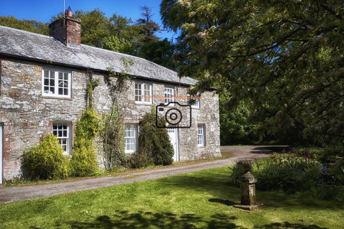 "Cottage and sundial," stock image