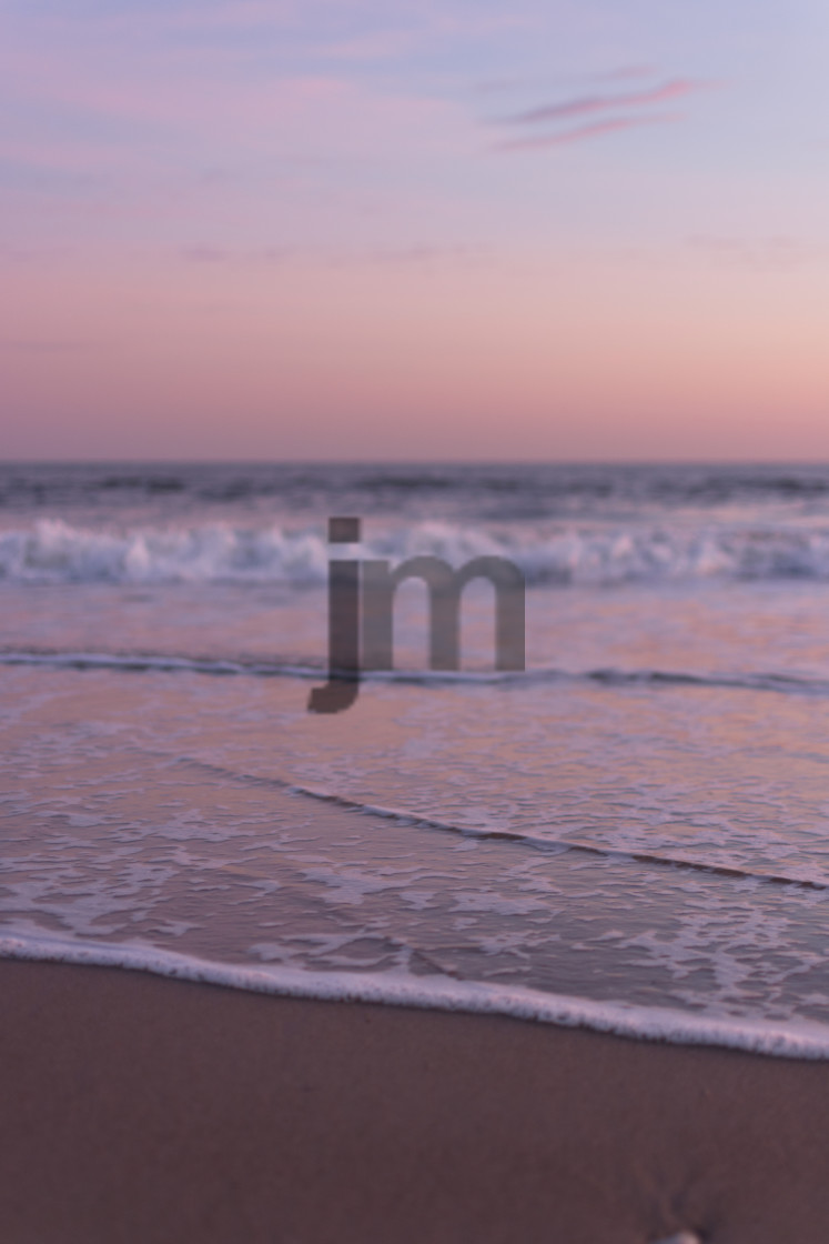 "Closeup of Waves Rolling into Shore" stock image