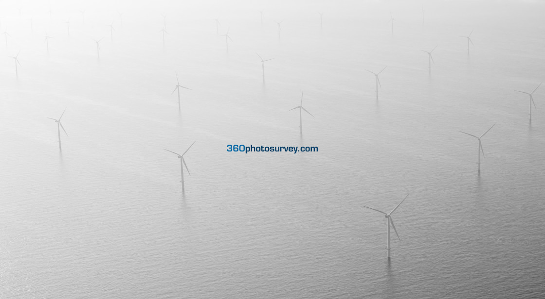 "Liverpool Bay wind turbines early morning mist" stock image