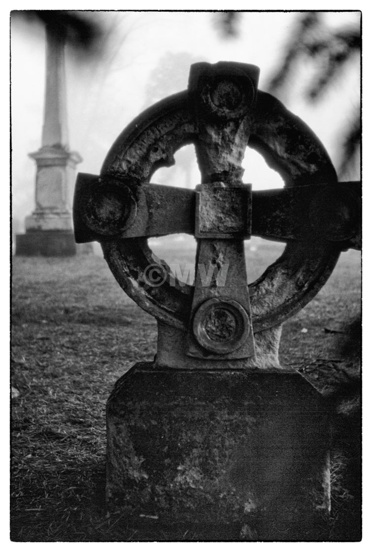 "Celtic cross gravestone in mist" stock image