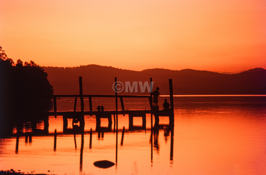 "Lake, dock, sunset" stock image