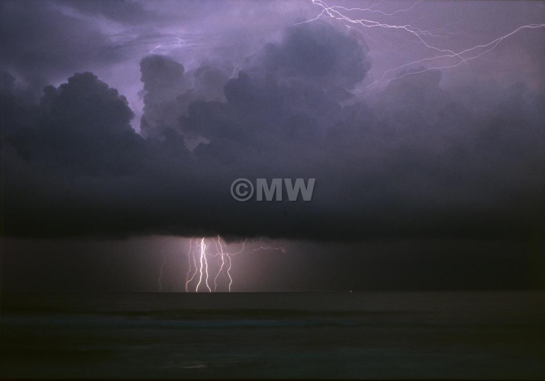 "Lightning storm at sea" stock image