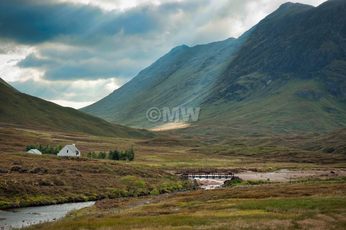 "Mountain, Valley, & cottage near Glen Coe" stock image