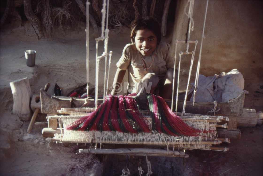 "Rajasthani boy with loom" stock image