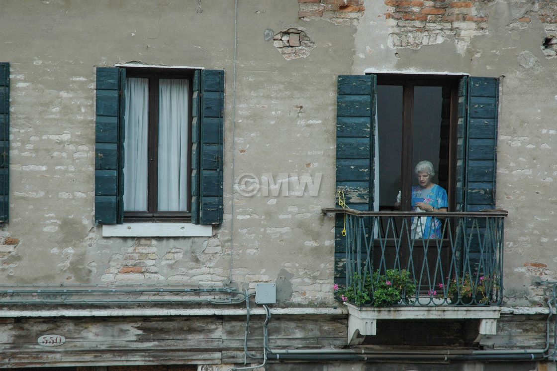 "Woman cleaning window" stock image