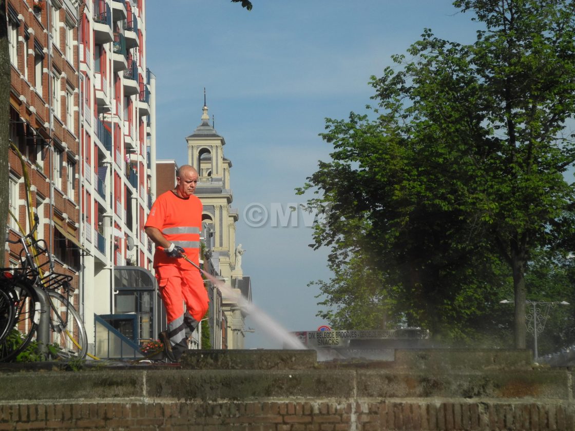 "Street cleaner with hose" stock image