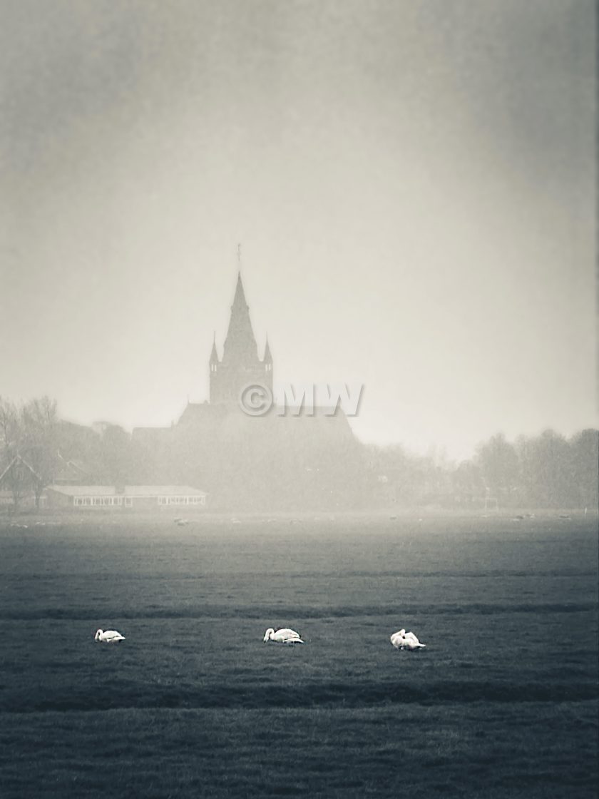 "Nes, church, swans, mist" stock image