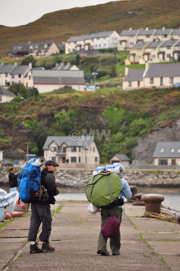 "Backpackers at Malaig-Skye ferry dock." stock image