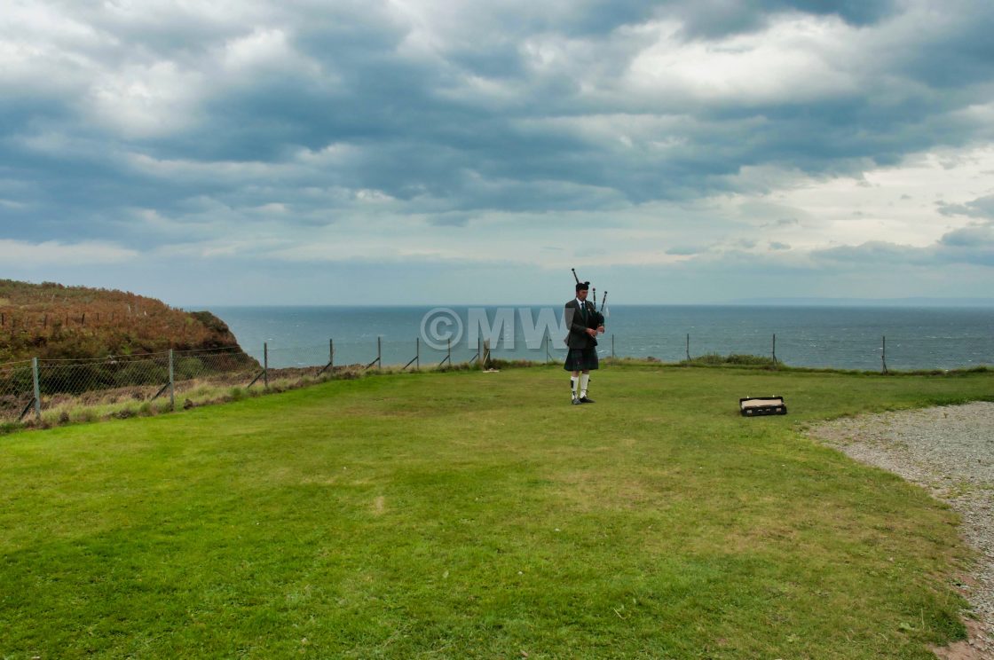 "Bagpipe busker at Kilt Rock, Skye" stock image