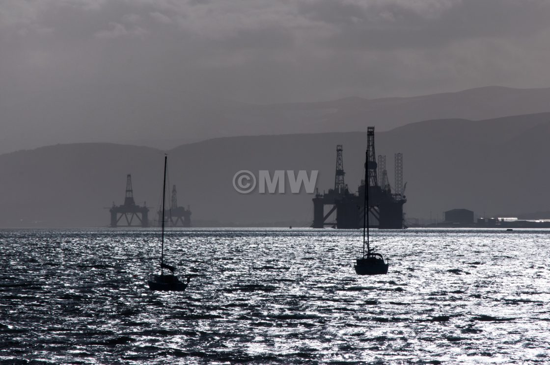 "Oil rigs & small boats" stock image