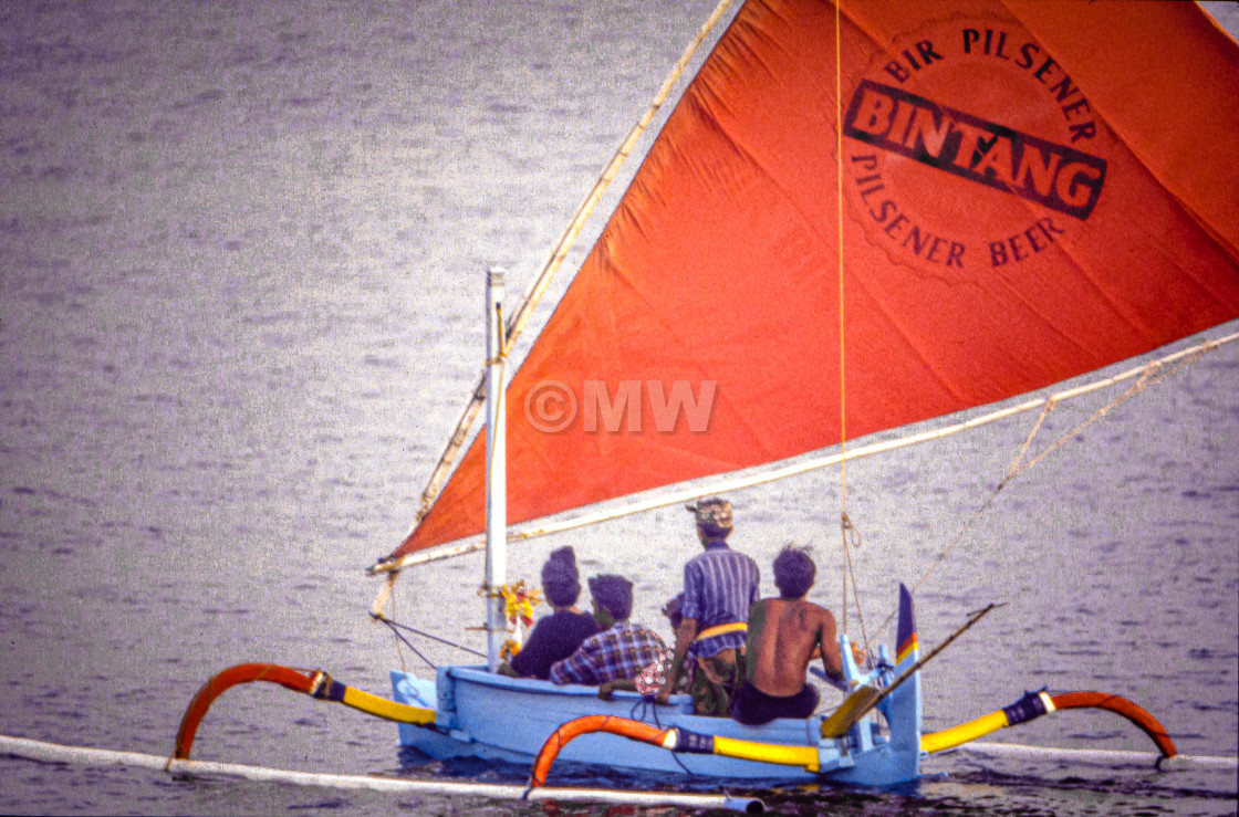 "Balinese in jukung boat" stock image