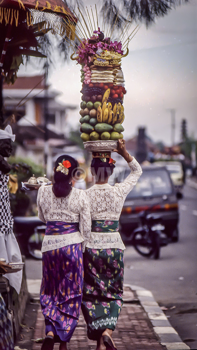 "Balinese women bring offerings to Pura Manik Tirta temple" stock image