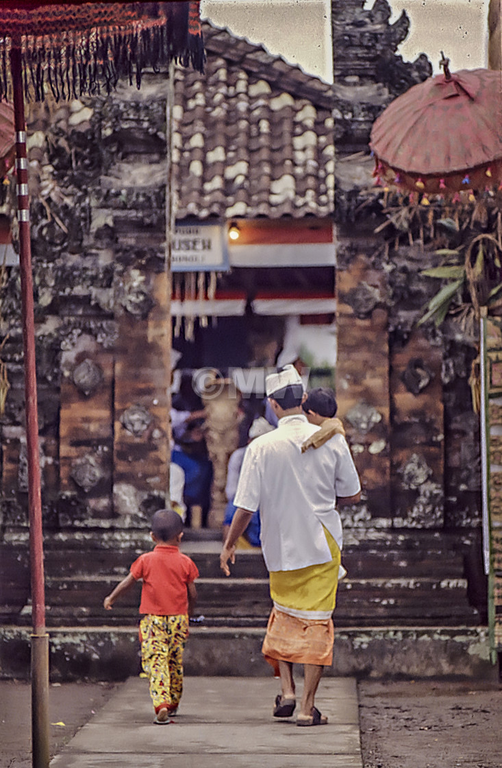 "Man & boys enter temple" stock image