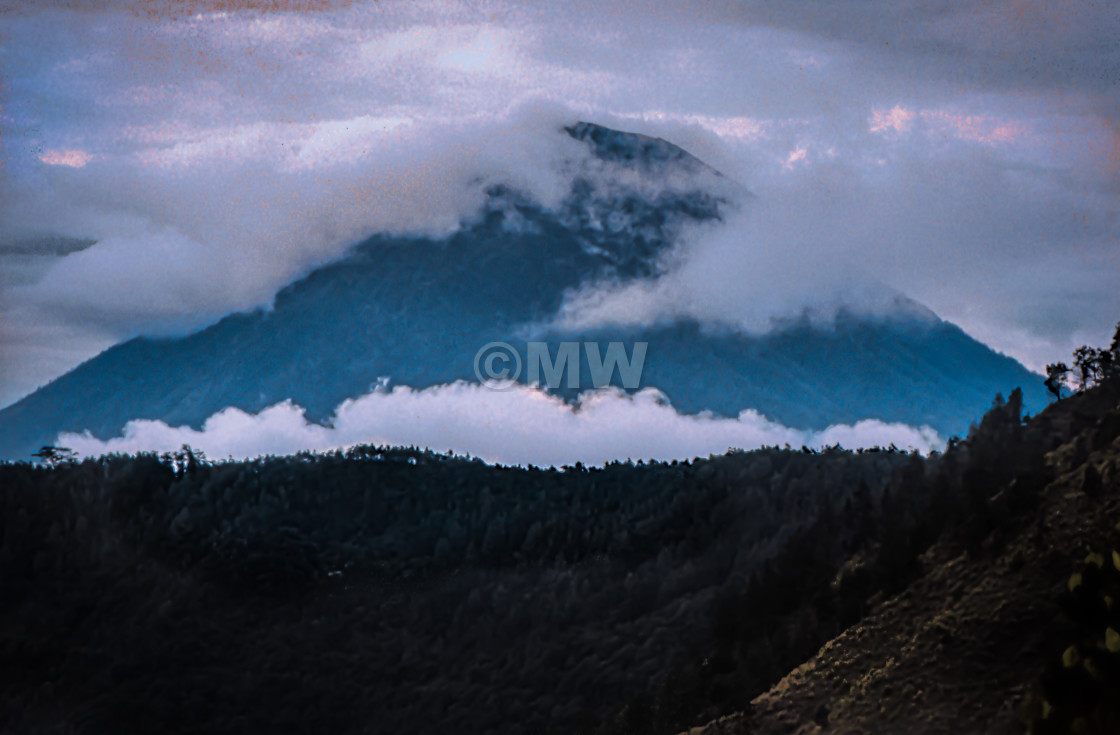 "Mt. (Gunung) Agung with trees & clouds" stock image