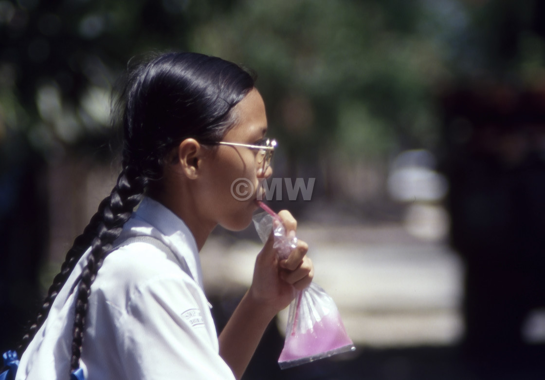 "Balinese Schoolgirl with Drink" stock image