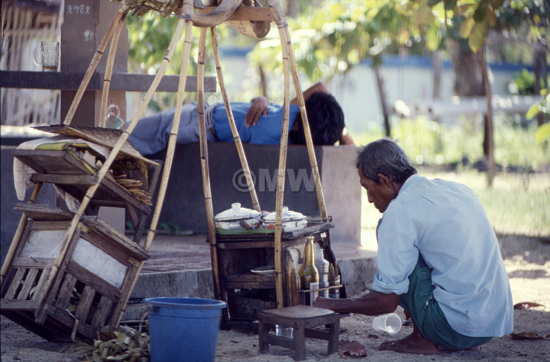 "Balinese street vendors resting" stock image