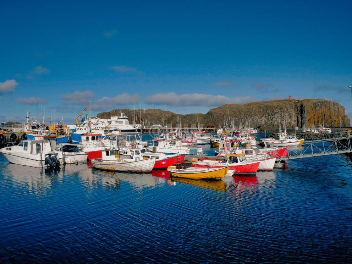 "Stykkisholmur harbor, lighthouse & fishing boats" stock image