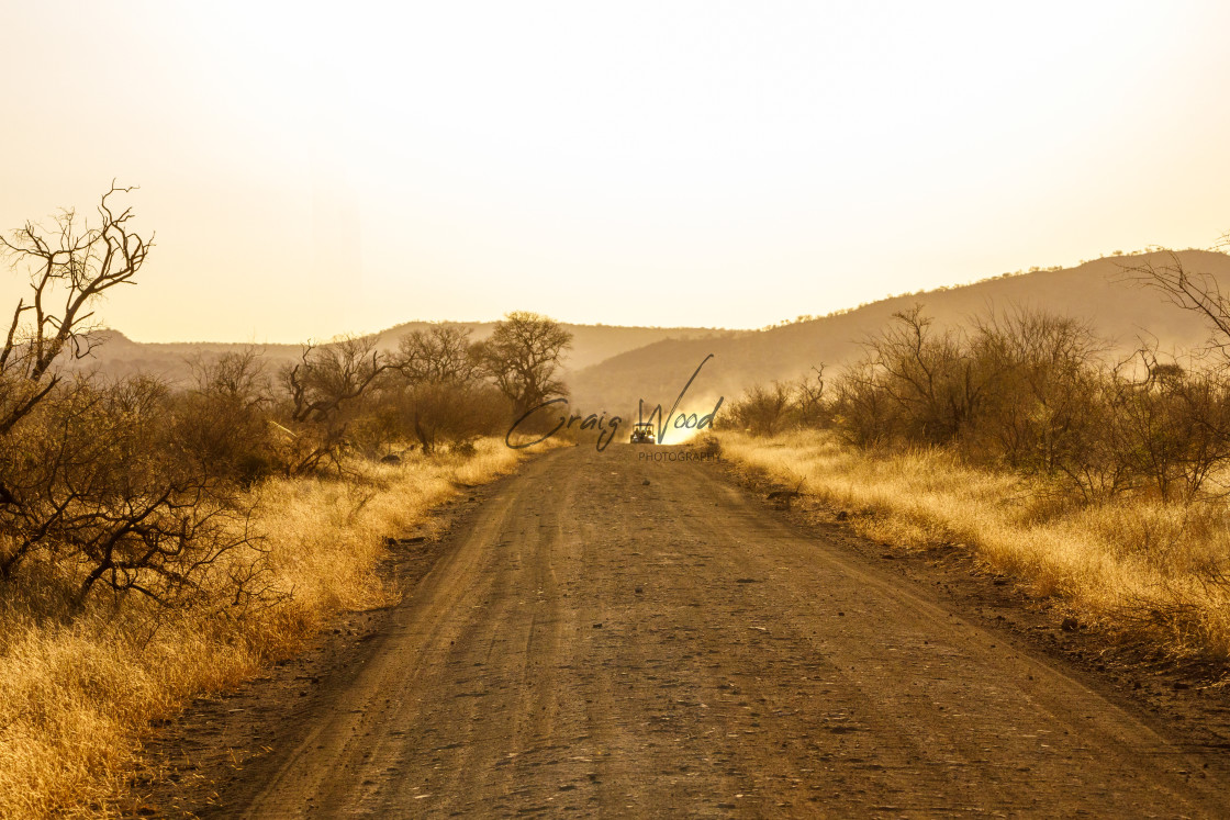 "Dirt Road with Game Vehicle" stock image