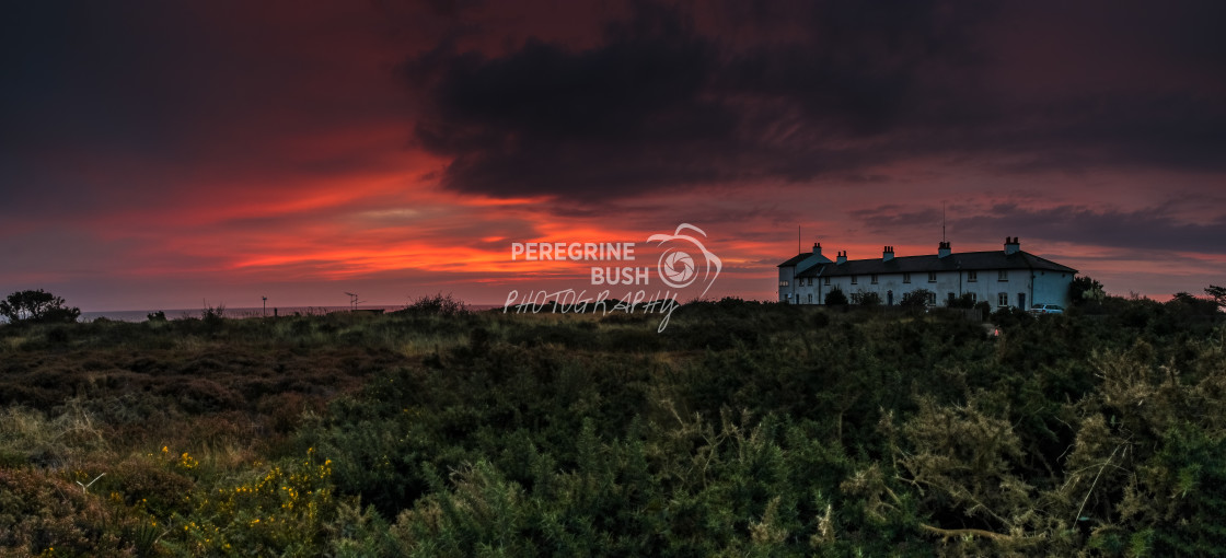 "Dunwich Coastguard Cottages at dawn" stock image