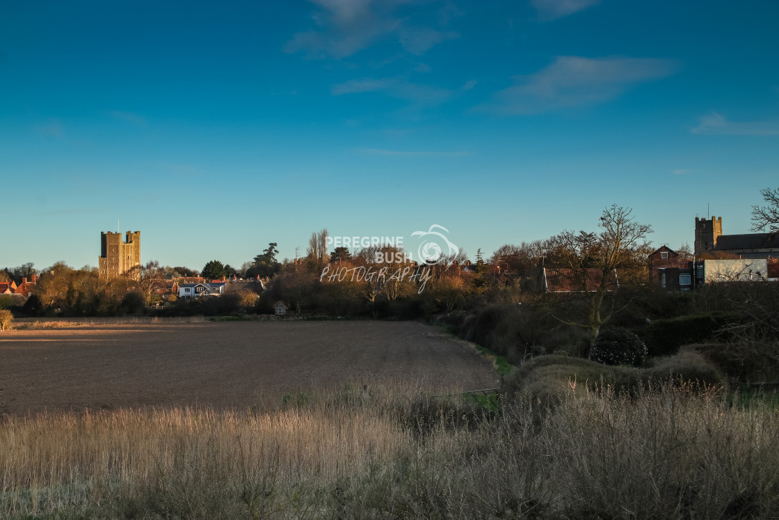 "Orford across the marshes in early morning sunlight" stock image