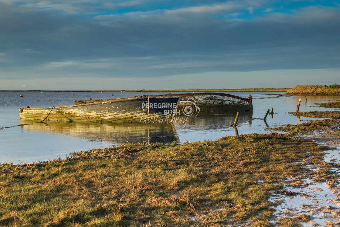 "Orford Quay wrecks in early morning sunlight" stock image