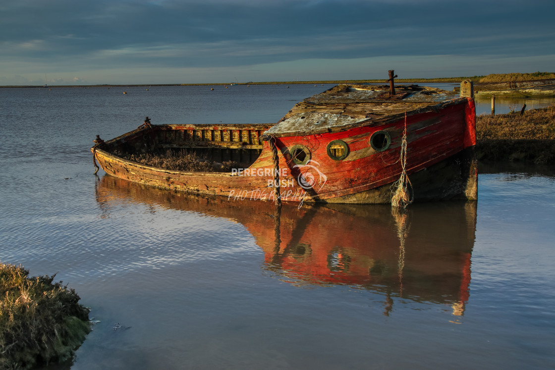 "Orford Quay wrecks in early morning sunlight" stock image