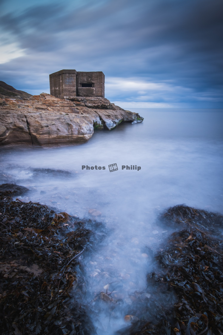 "Seaweed gathering at the Cornelian pillbox" by Photography by Philip - $14.95 "Seaweed gathering at the Cornelian pillbox" stock image