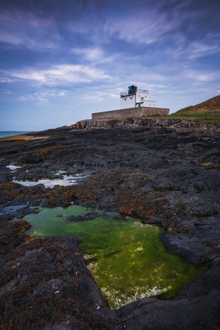 "Illuminated in green at Bamburgh Lighthouse, Northumberland" by Photography by Philip - $14.95 "Illuminated in green at Bamburgh Lighthouse, Northumberland" stock image