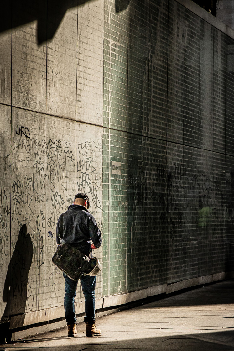 "Man,shadow and Graffiti." stock image