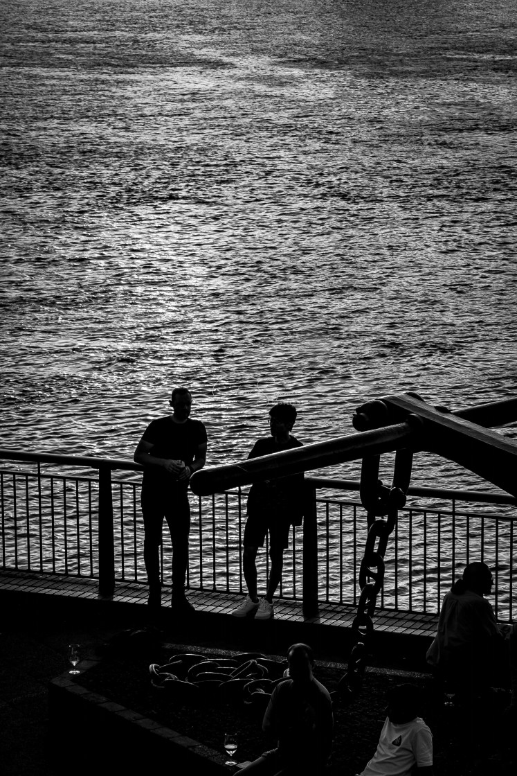 "Men in silhouette by the River Thames" stock image