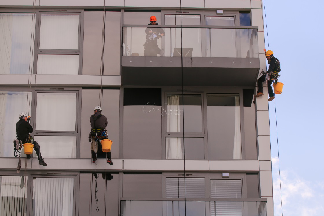 "Abseiling Window cleaners." stock image