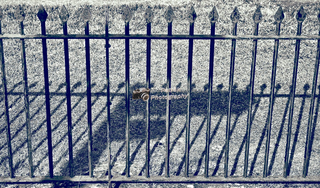 "Victorian Railings & Road Sign Shadows" by Keith Patrak - £15.00 "Victorian Railings & Road Sign Shadows" stock image