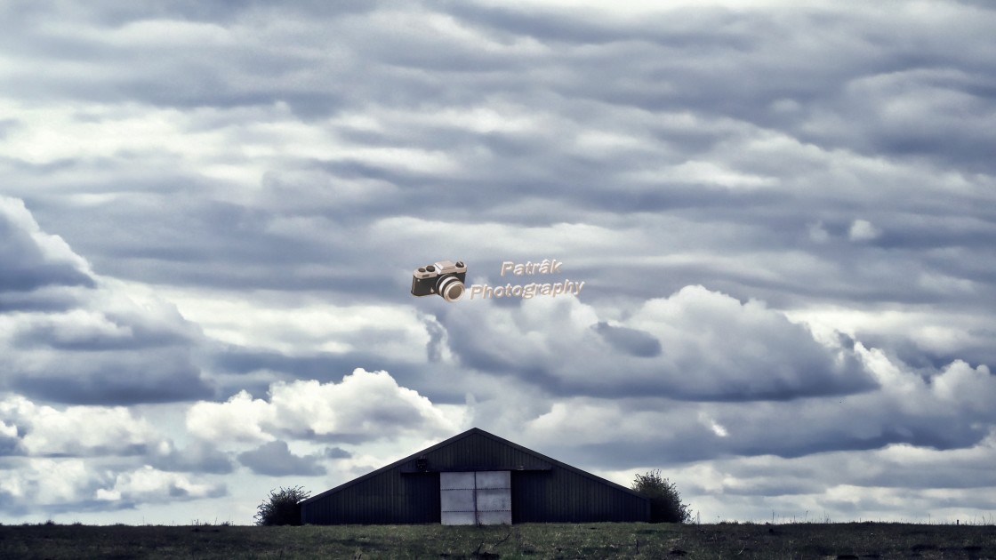 "Triangular Barn Cloudscape" by Keith Patrak - £15.00 "Triangular Barn Cloudscape" stock image