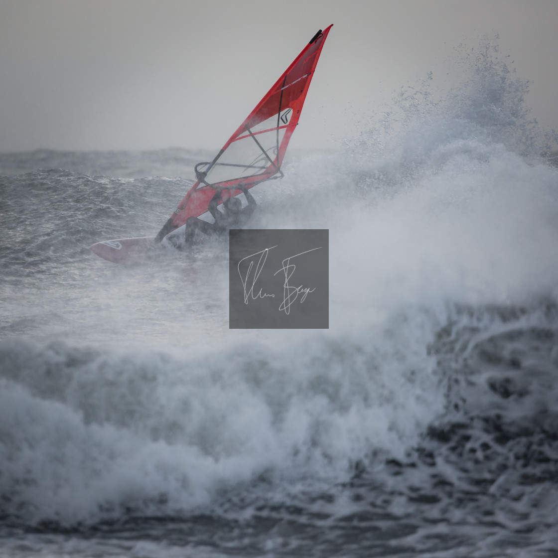 "Windsurfer in the waves" stock image