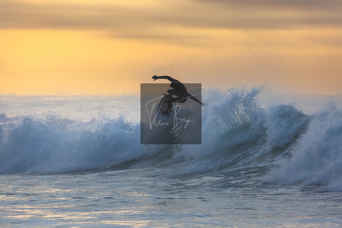 "Golden hour surf" stock image