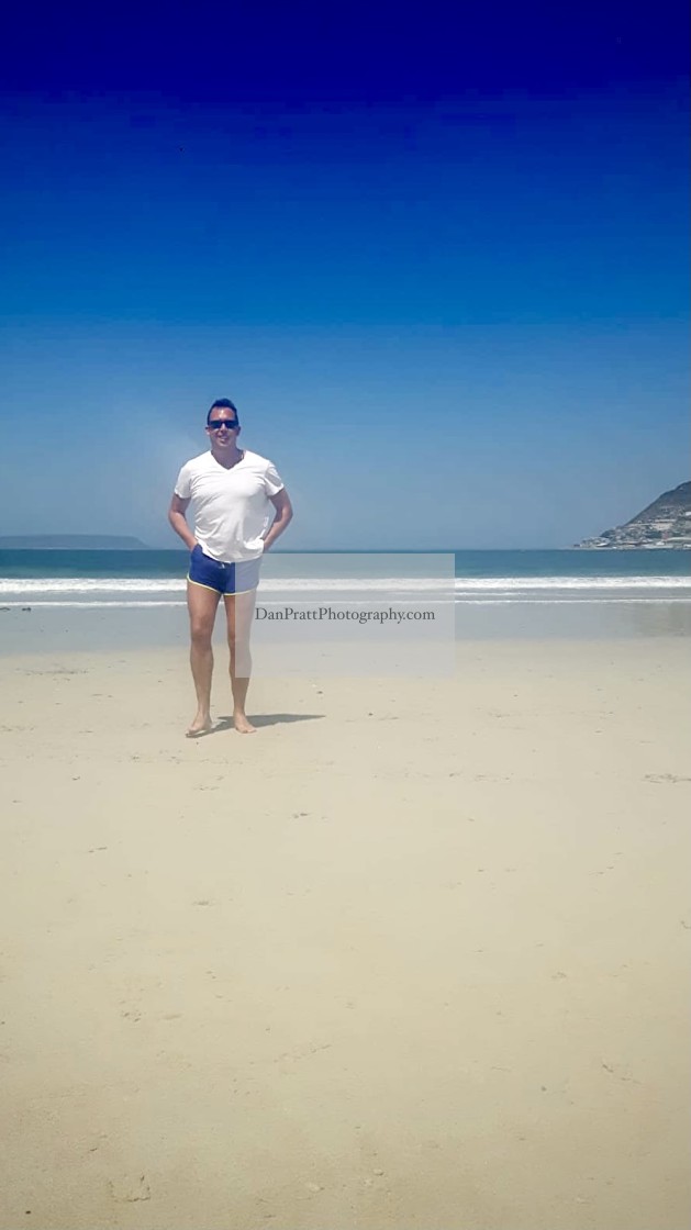"Man on an empty beach" stock image
