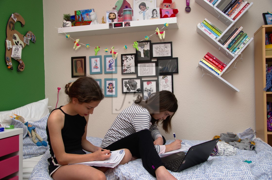 "Children at home during Coronavirus lockdown doing their school work" by HD57 lifestyle stock photography - $25.11 "Children at home during Coronavirus lockdown doing their school work" stock image