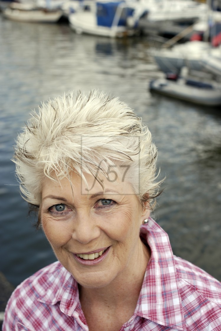 "Attractive mature woman enjoying a successful retirement lifestyle." stock image