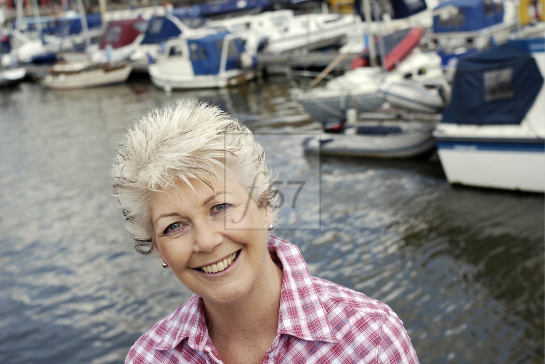 "Attractive mature woman enjoying a successful retirement lifestyle." stock image