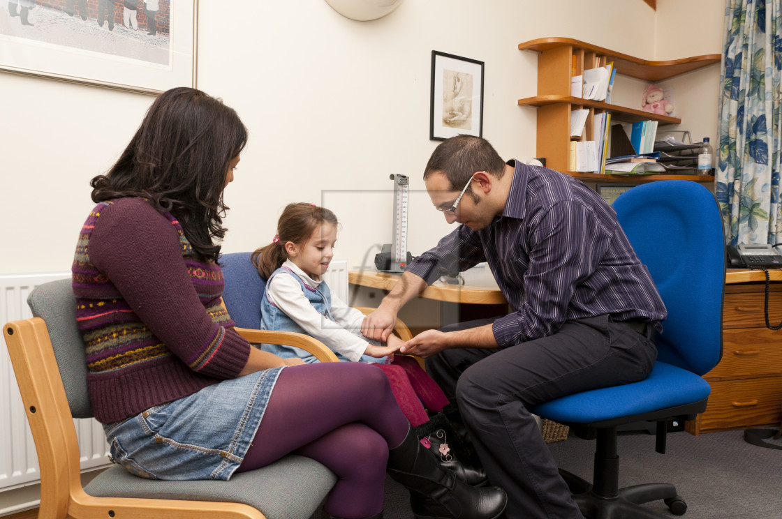 "GP Doctor surgery patient consultation UK" stock image