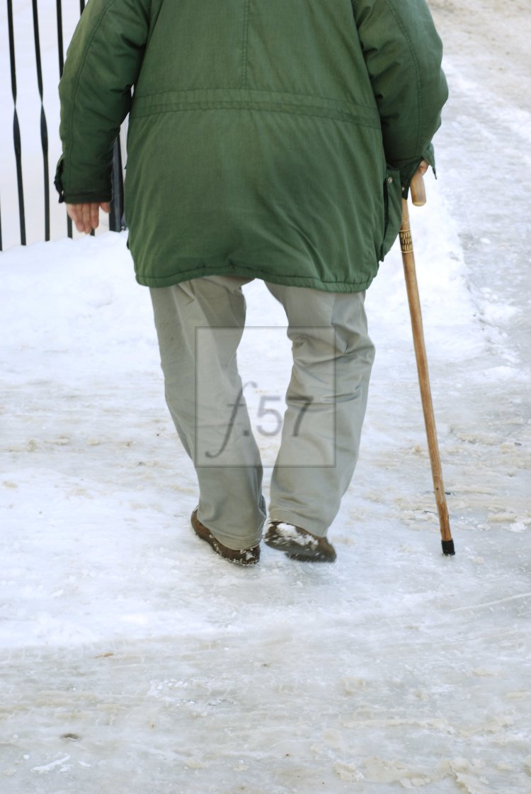 "Senior elderly man walking with stick on icy surface in winter" by HD57 lifestyle stock photography - $29.82 "Senior elderly man walking with stick on icy surface in winter" stock image